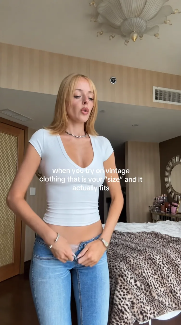 A creator holding a product up to the lens